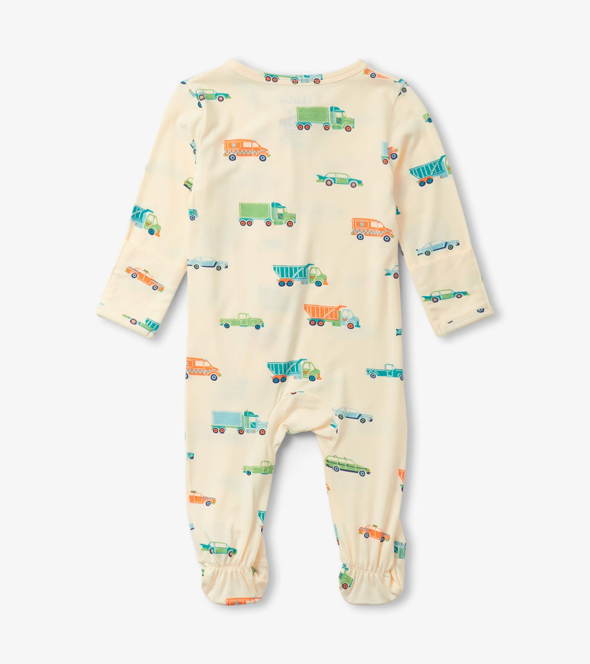 Cream footed sleeper featuring colorful truck and car patterns, designed for baby boys.