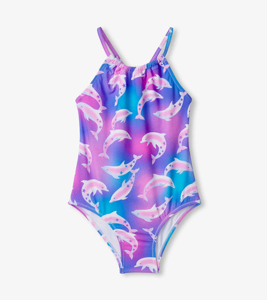 Colorful girls' swimsuit featuring a dolphin pattern in shades of pink and blue, with adjustable straps and a gathered front.