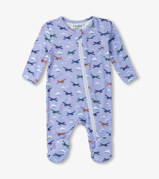 Light purple footed sleeper featuring colorful airplane patterns and a front zipper for easy dressing.