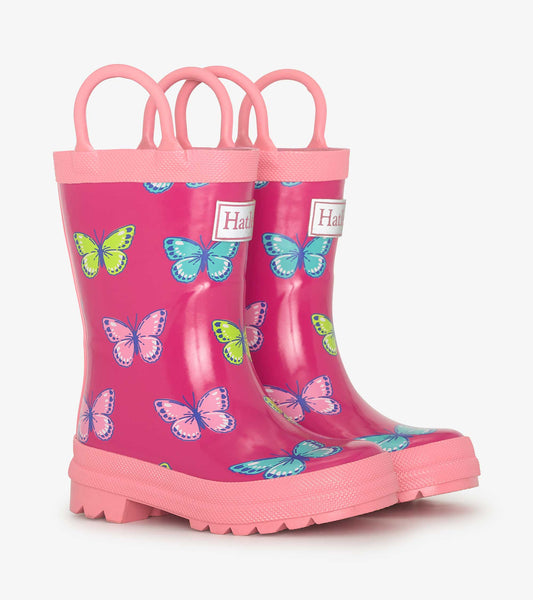 Pink rain boots featuring colorful butterfly patterns and sturdy handles for easy wear. Ideal for kids' outdoor play.