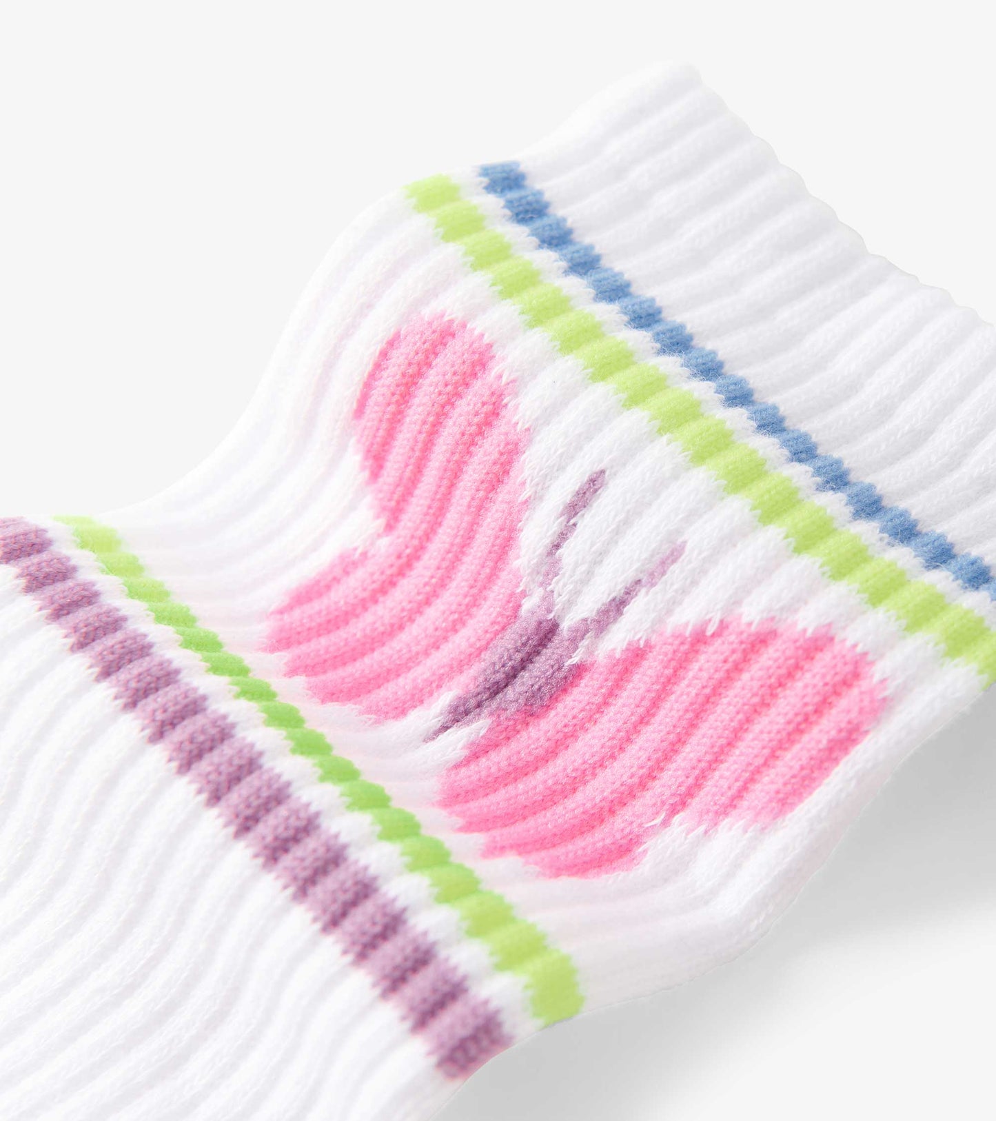 White tube socks featuring a pink butterfly design with colorful striped accents in green and blue.