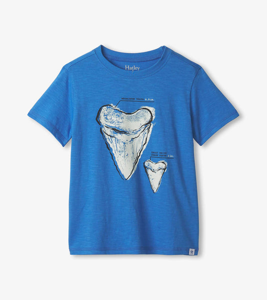 Blue graphic tee featuring shark tooth illustrations in white and black, suitable for boys.