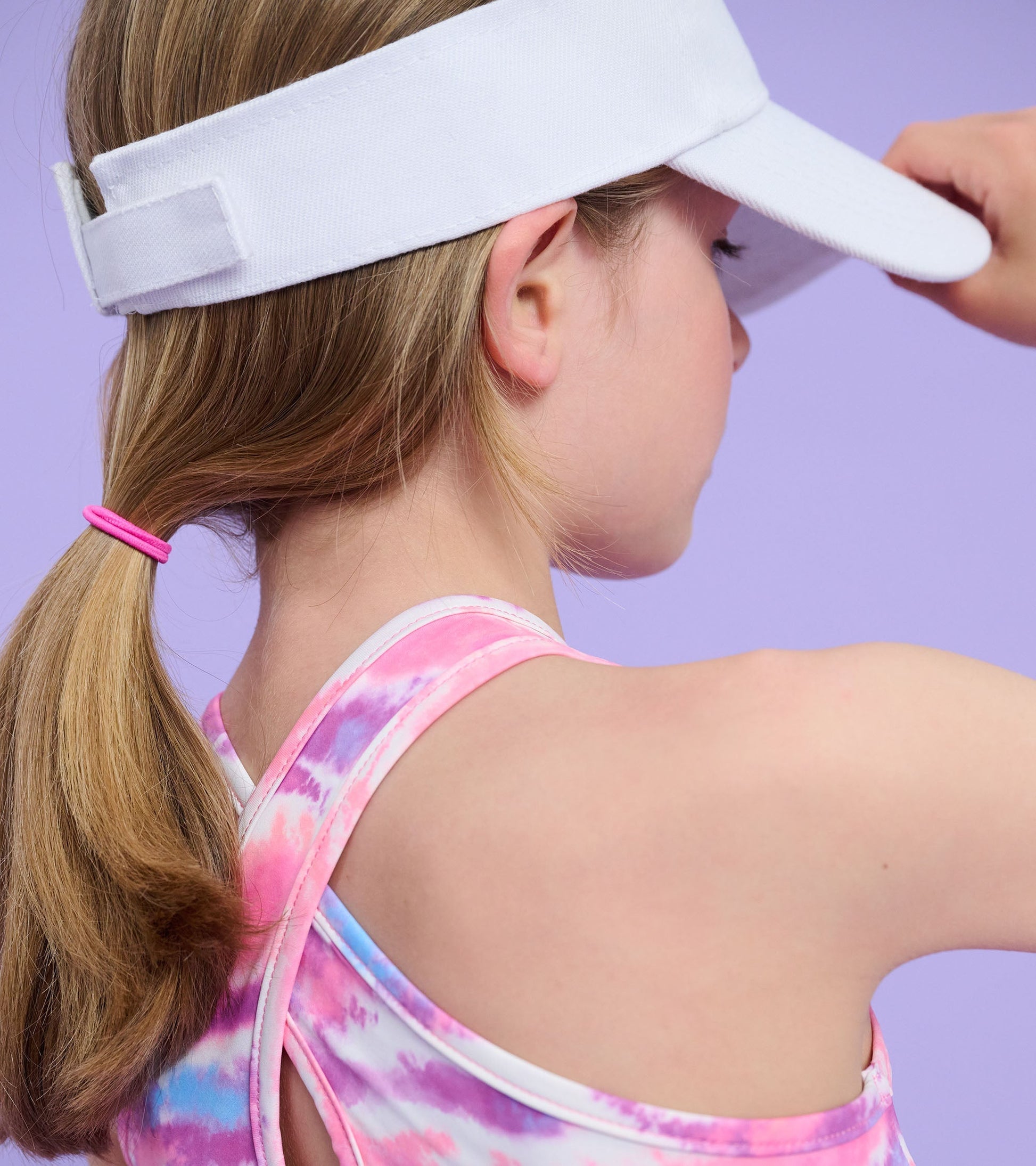 Girls' active A-line dress featuring a candy ombre pattern in pink and purple, with a racerback design.