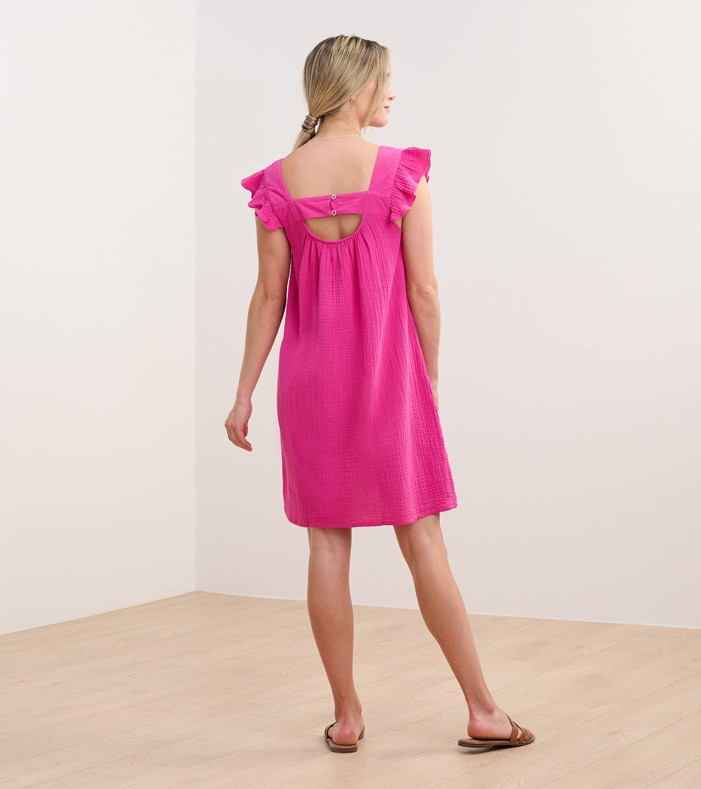 Fuchsia flutter sleeve dress with a square back cutout, shown from the back, perfect for casual wear.