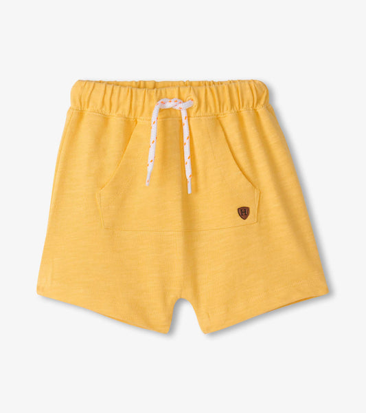 Golden cream kangaroo shorts with an elastic waistband and front pockets, designed for baby and toddler boys.
