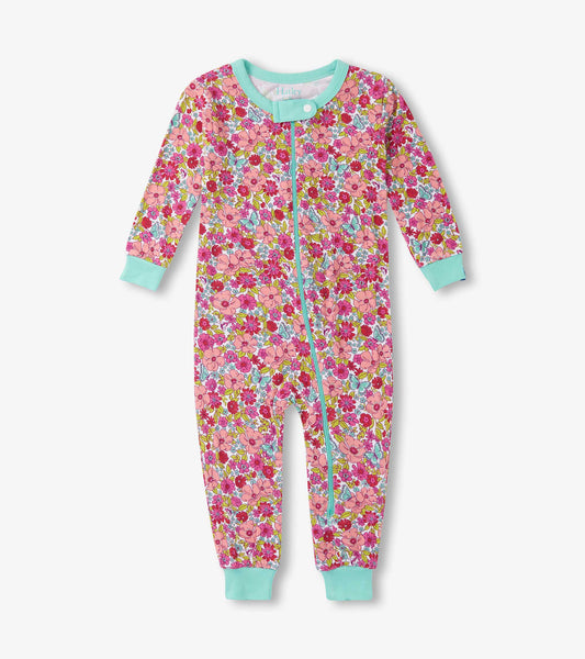 Colorful floral sleeper with long sleeves, a front zipper, and mint green cuffs, suitable for baby girls.