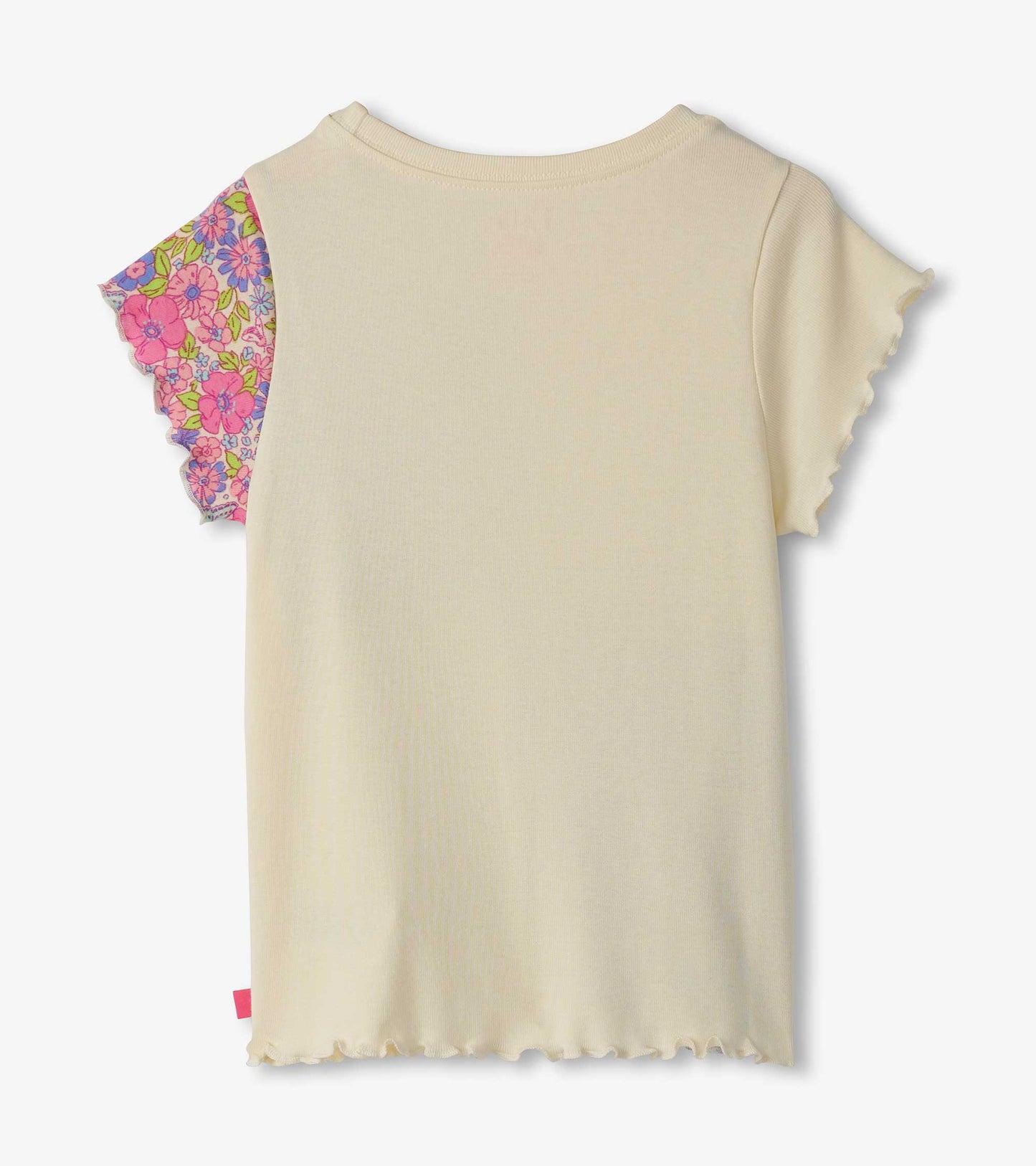 Cream-colored tee with colorful floral patchwork sleeves and ruffled edges, suitable for casual wear.