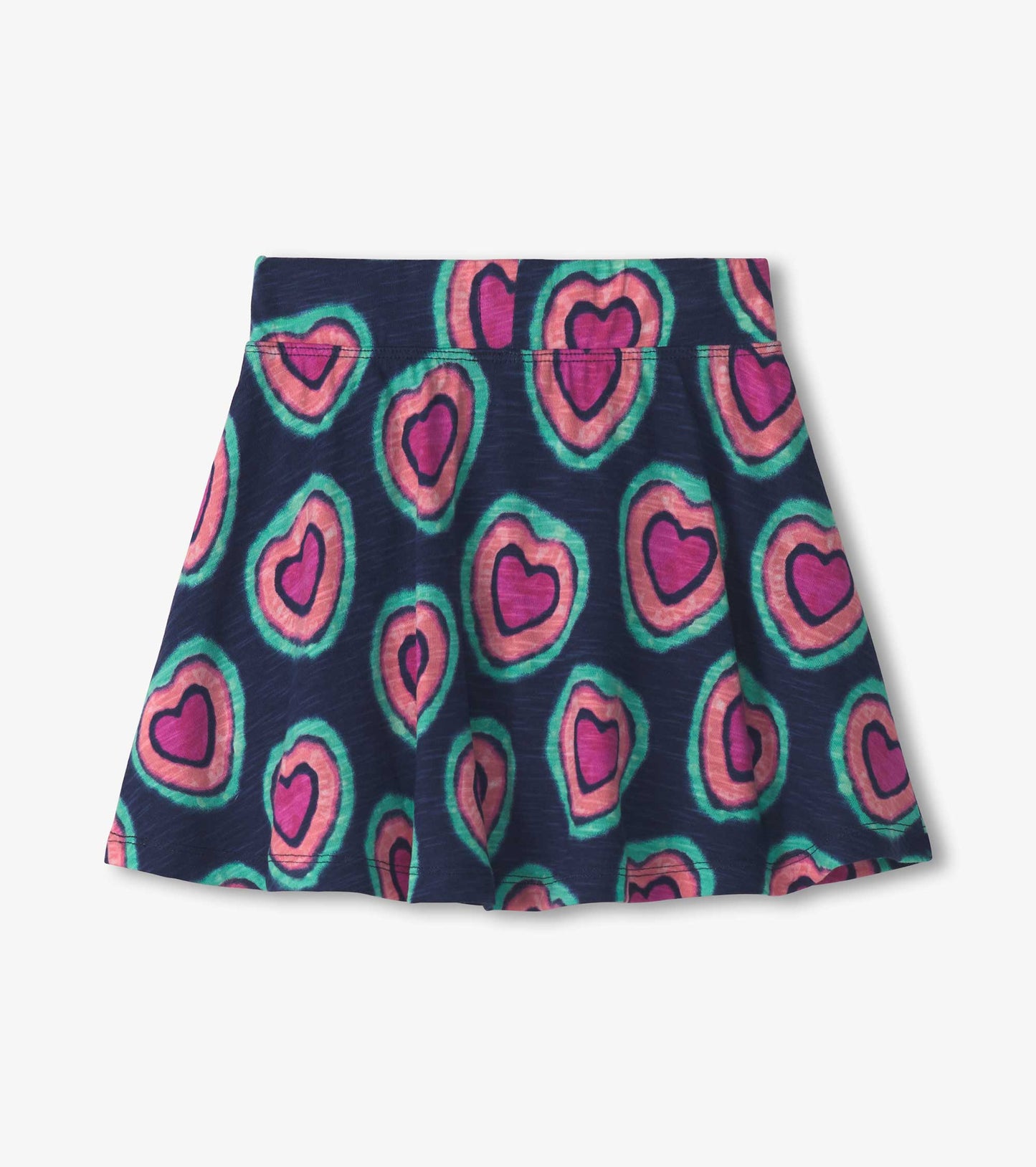 Navy skort featuring a playful heart pattern in pink and green, designed for girls, with a flared silhouette.