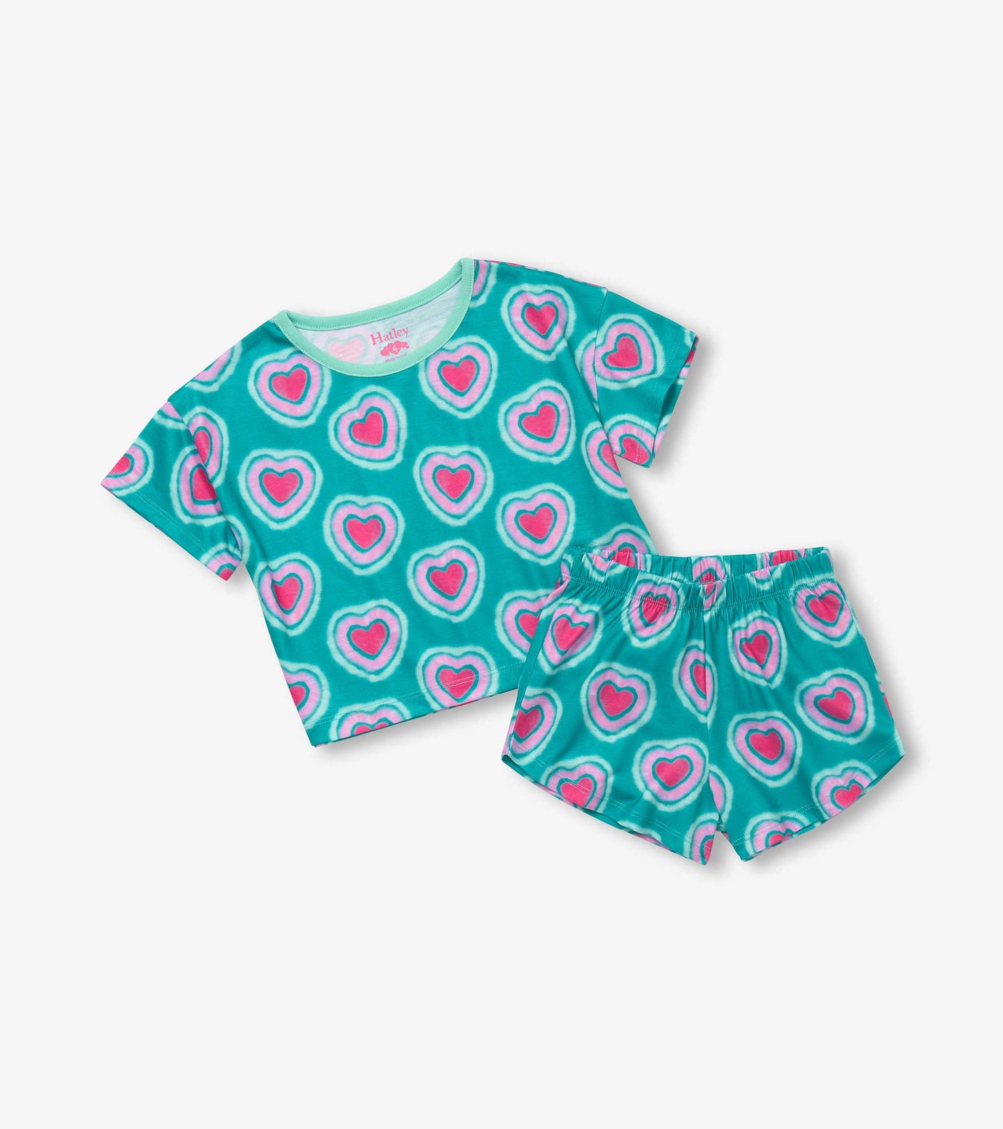 Teal pajama set featuring a short-sleeve tee and shorts, adorned with pink glowing hearts pattern.