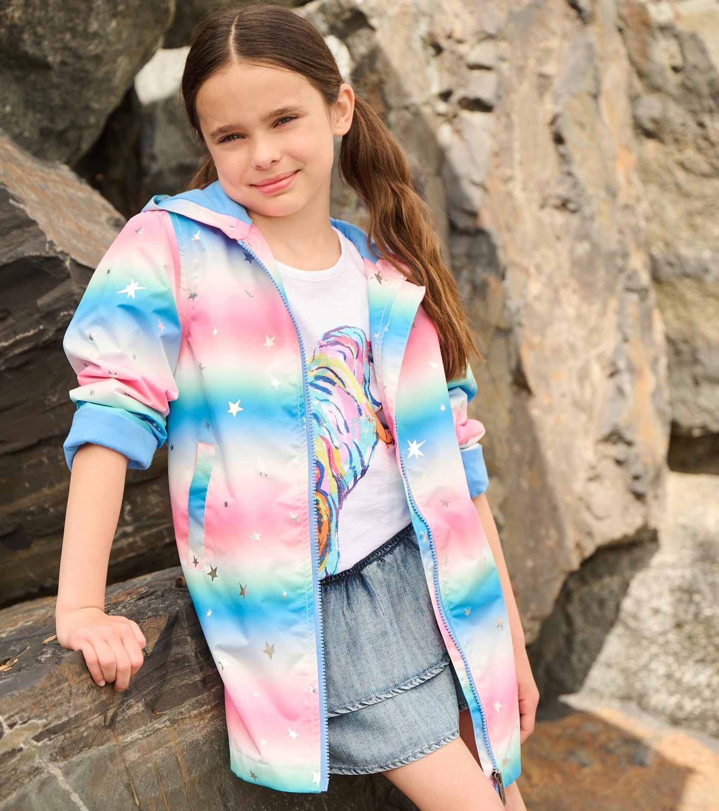 Pastel A-line swing jacket with glitter stars, featuring a zip front and hood, perfect for girls.