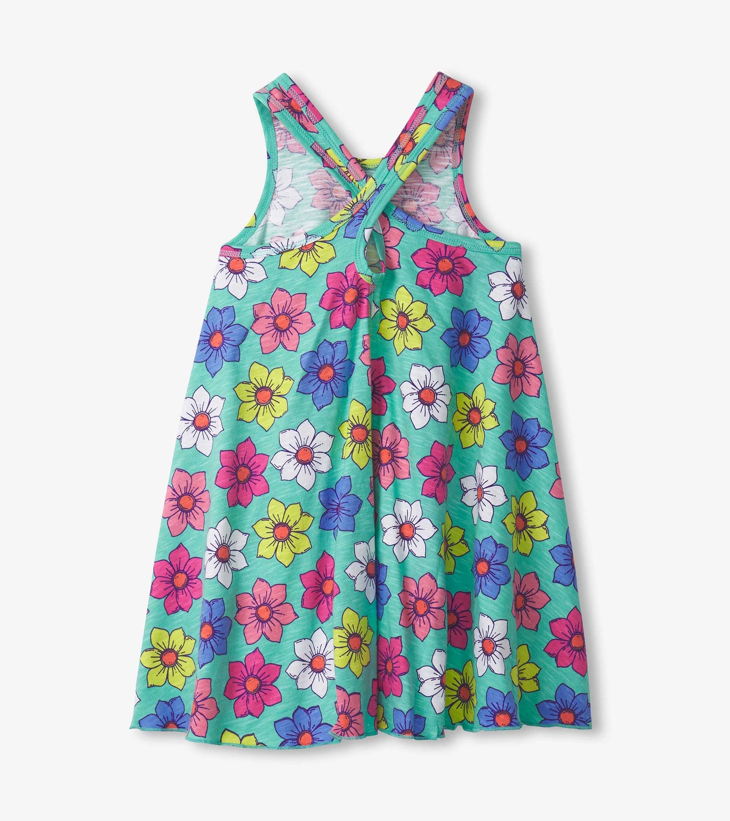 Trapeze dress with a vibrant floral pattern in pink, blue, yellow, and white on a teal background. Cross-back straps.