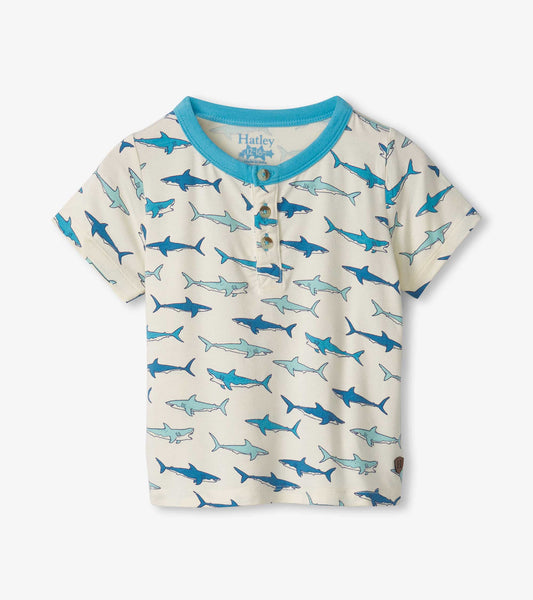Light cream bamboo henley featuring a playful shark pattern in shades of blue, with a turquoise collar and buttons.