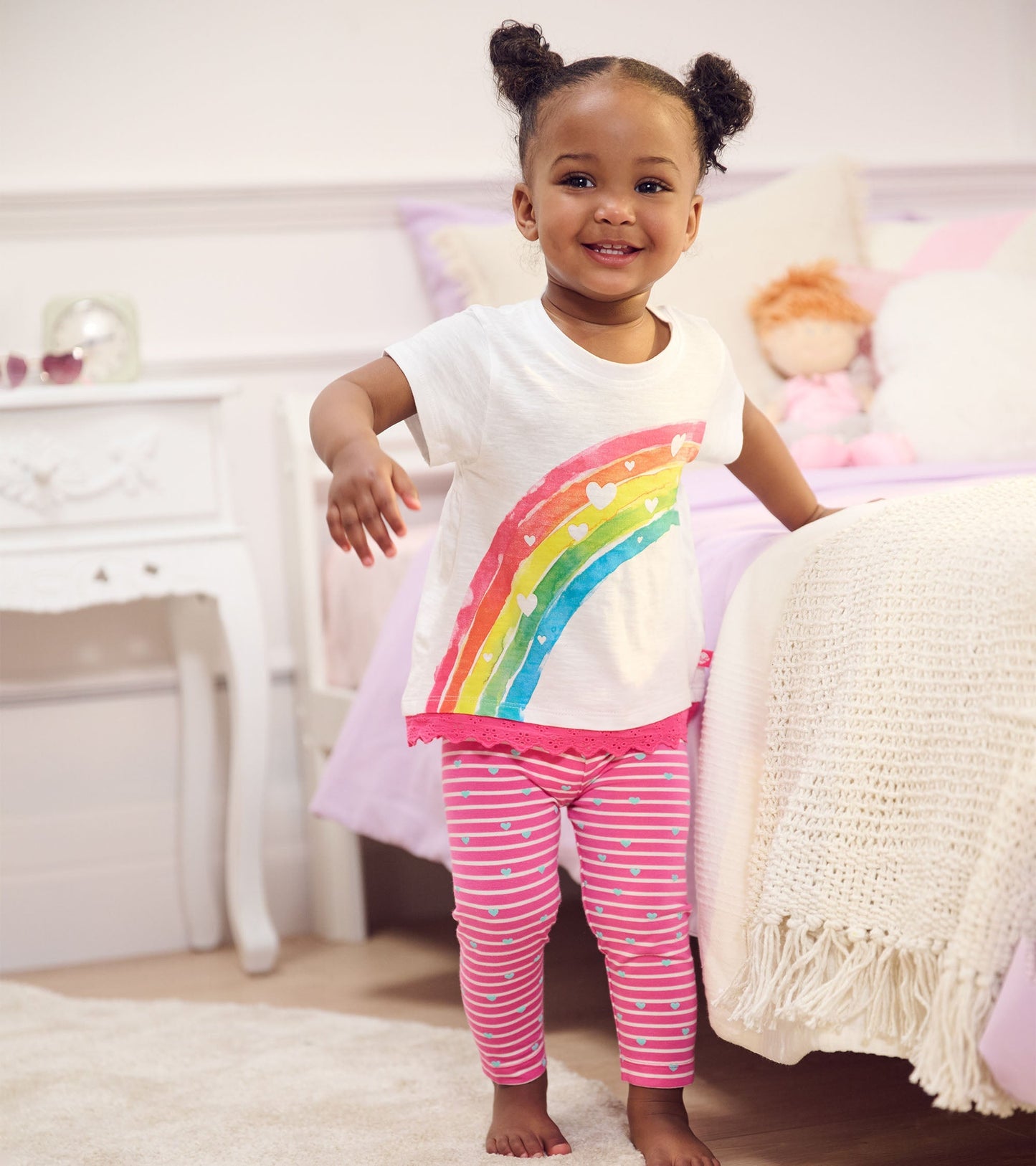 Pink striped leggings with heart patterns, made from soft bamboo fabric, suitable for baby and toddler girls.