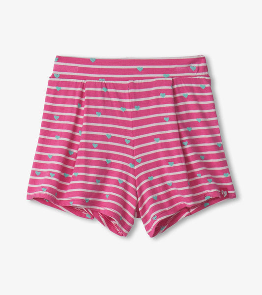 Pink striped shorts with small blue hearts, featuring a comfortable waistband and patch pockets. Suitable for baby and toddl…
