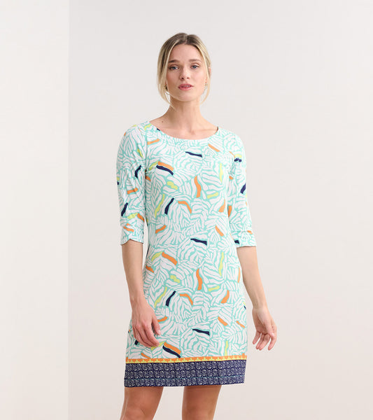 Light green dress with organic leaf pattern, three-quarter sleeves, and a navy patterned hem. Suitable for casual wear.