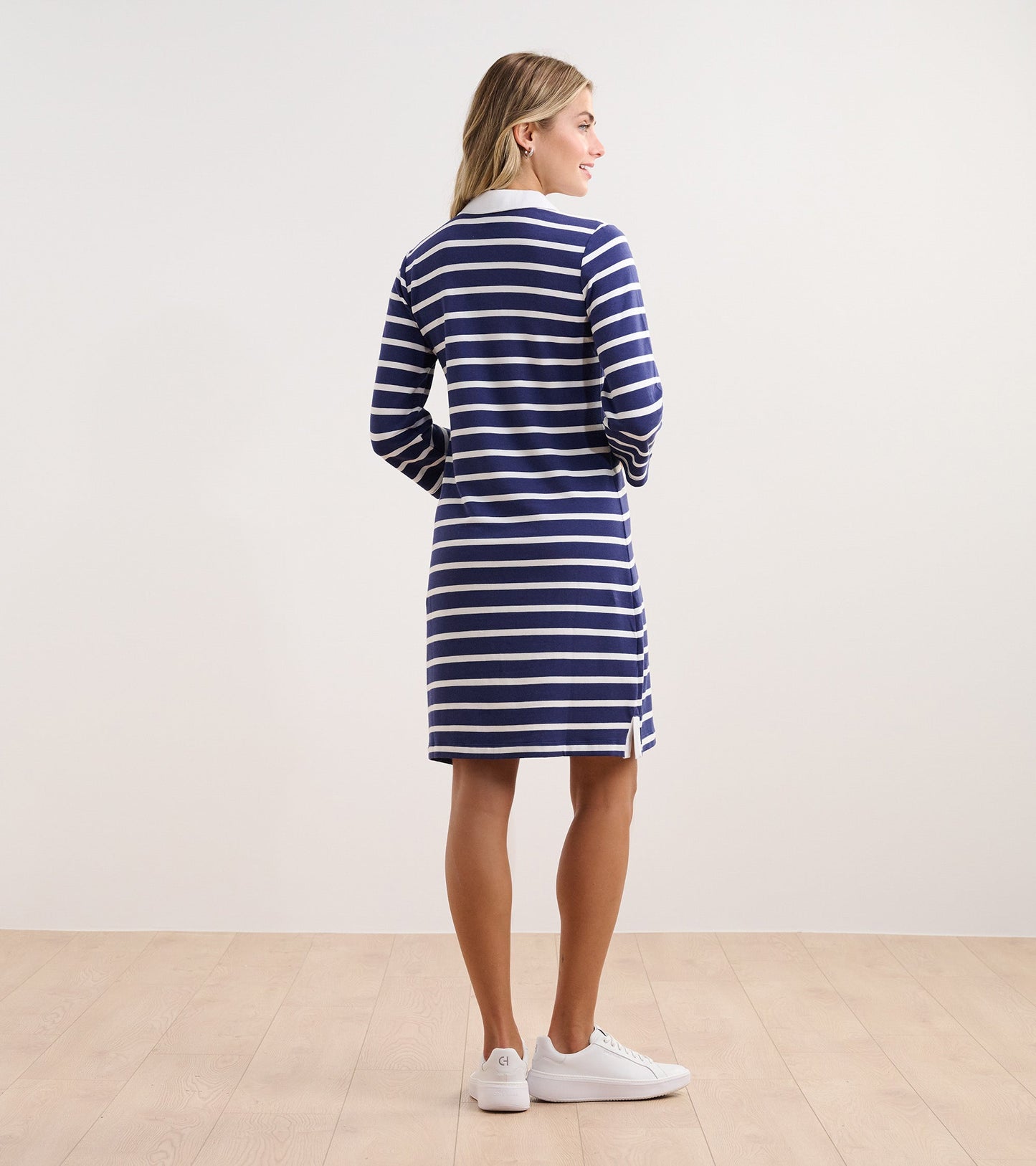 Navy and white striped dress with long sleeves and a collar, viewed from the back.