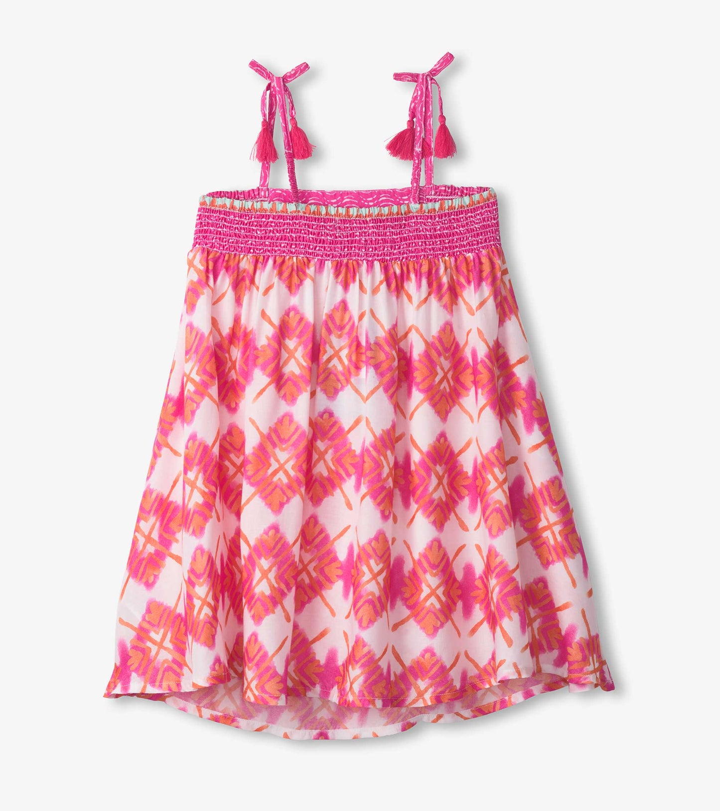 Floral dress with pink and orange sunburst pattern, smocked bodice, and adjustable straps with tassels.