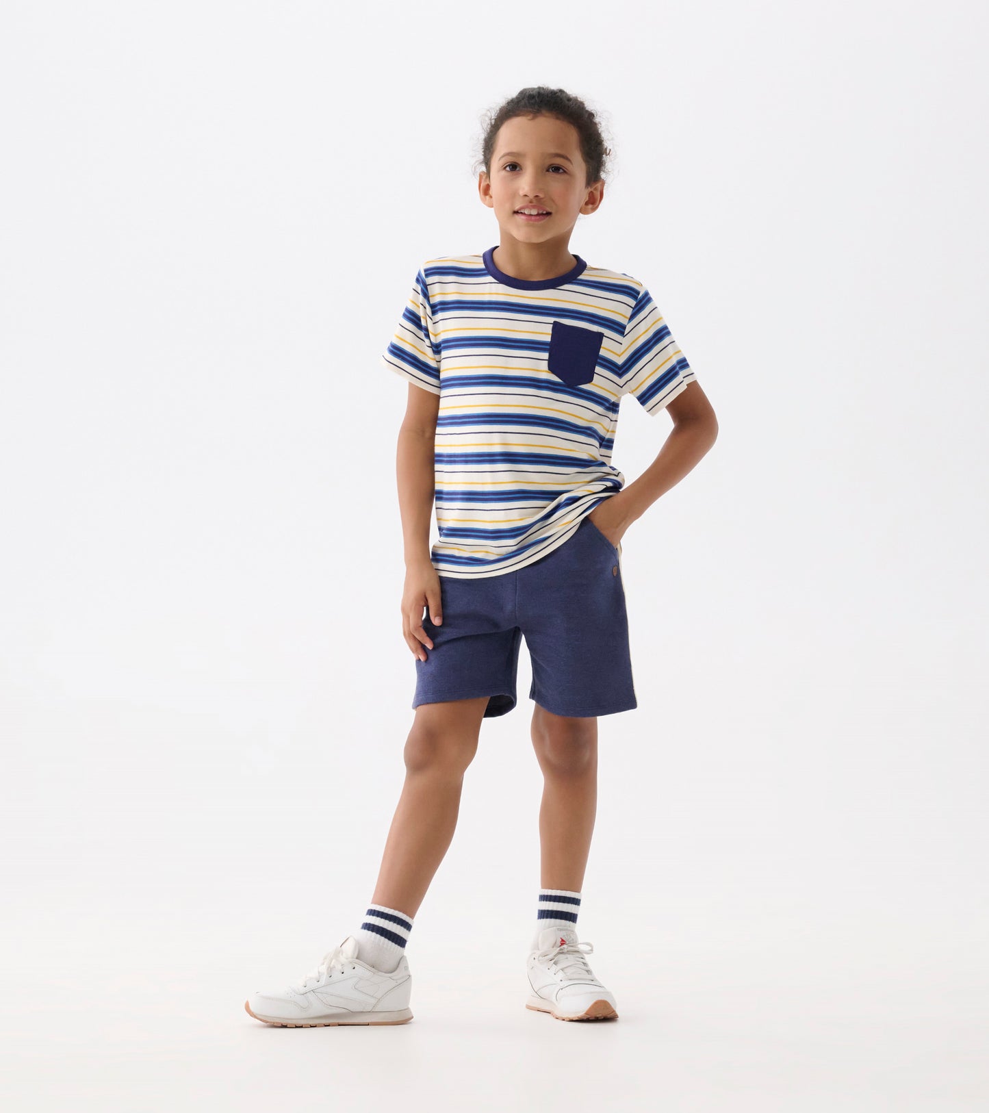 Boys' short-sleeve tee in blue and yellow stripes with a chest pocket, paired with navy shorts.