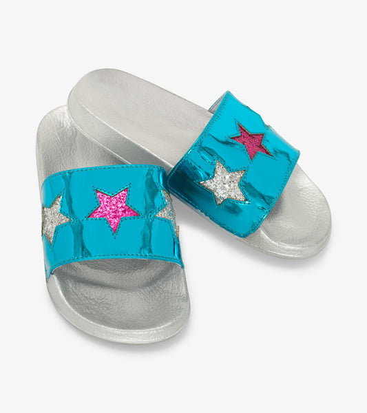 Turquoise slide sandals featuring shiny star appliqués in pink, silver, and glitter on a silver sole.