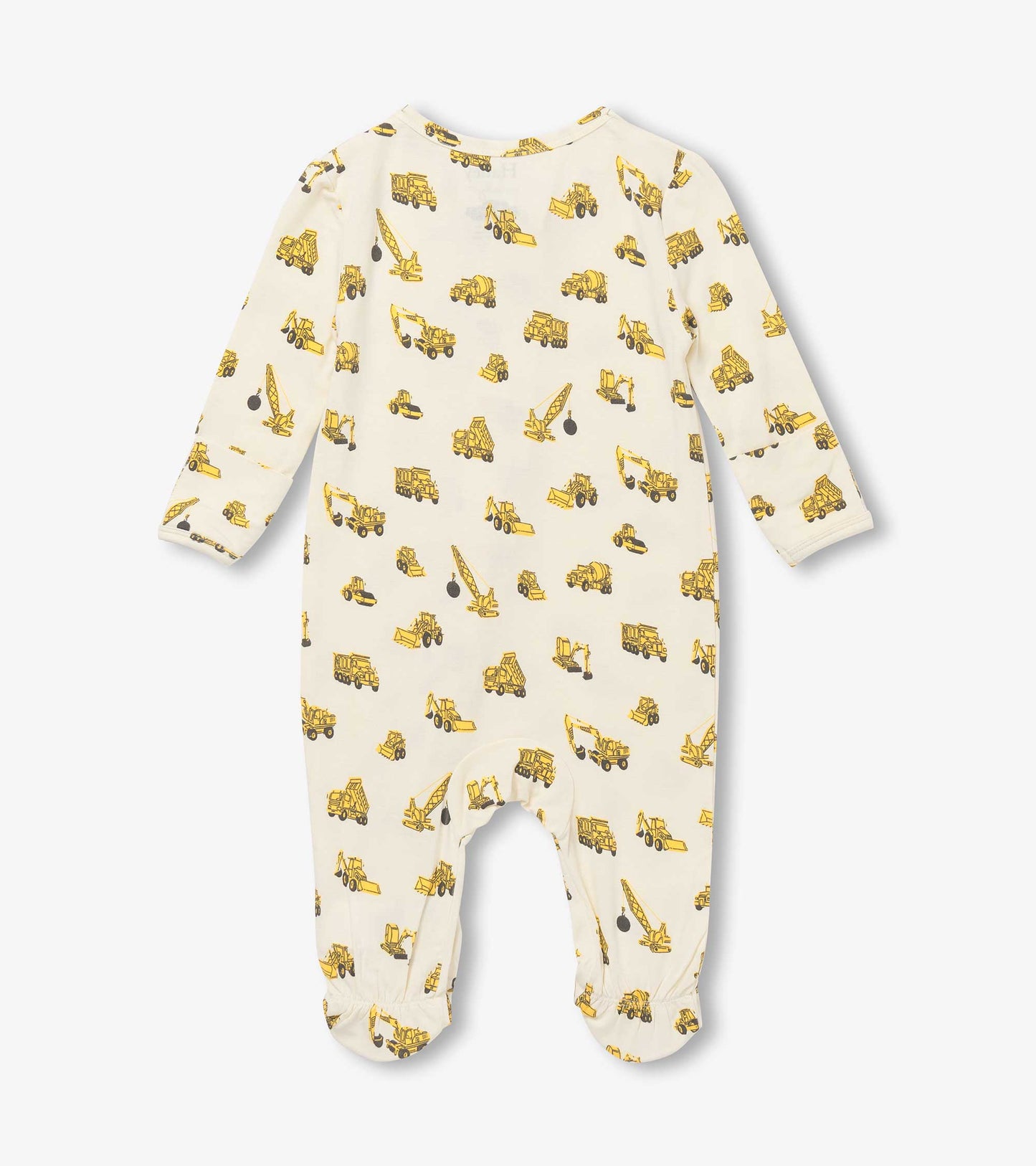 Cream footed sleeper featuring yellow construction vehicle print, long sleeves, and elasticized cuffs.