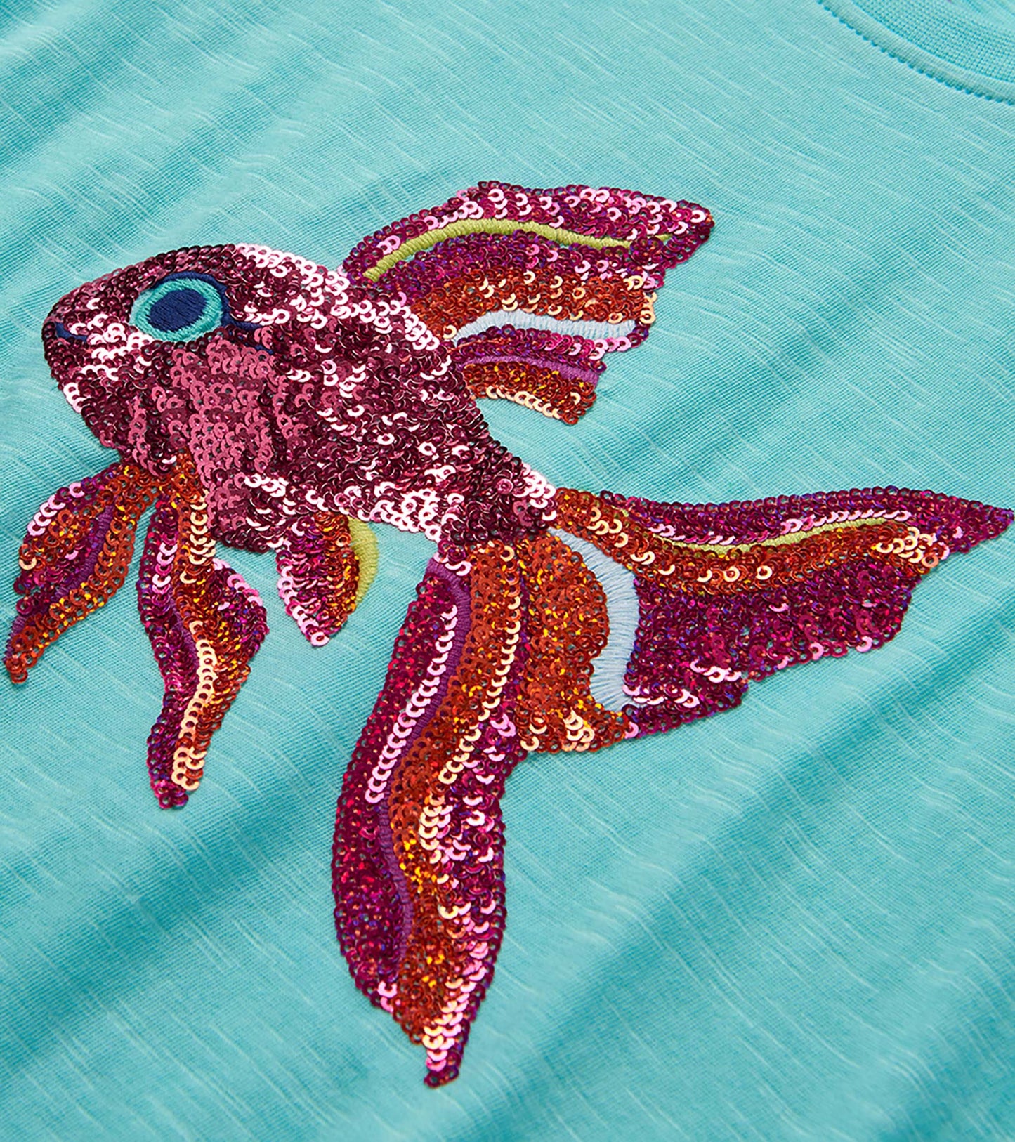 Turquoise T-shirt with large multicolor sequined tropical fish graphic