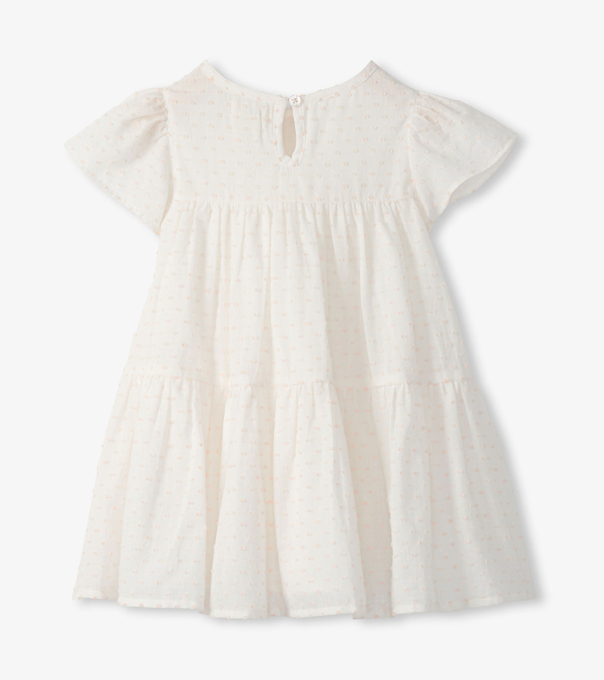 Back view of ivory Swiss dot toddler dress with keyhole button closure and tiered skirt