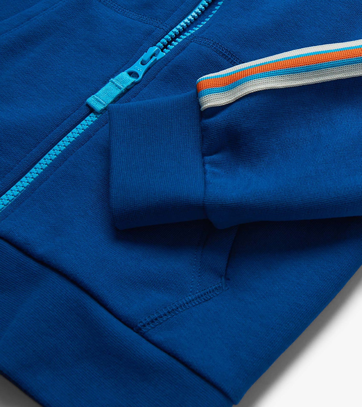 Blue boys' full-zip hoodie with turquoise zipper and striped sleeve detail, close-up view