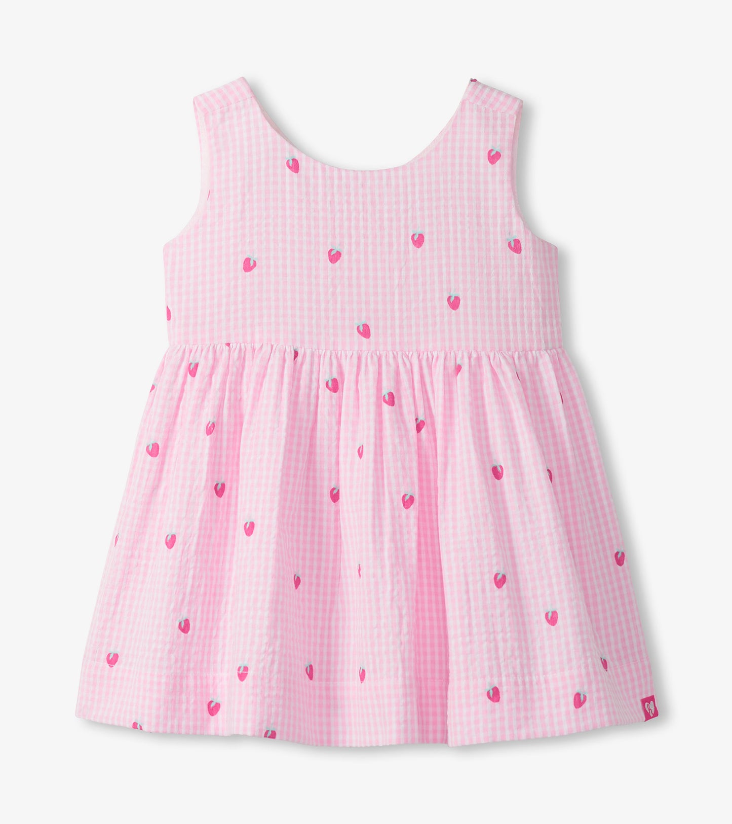 Front view of sleeveless pink gingham dress with tiny berry motifs and a gathered skirt