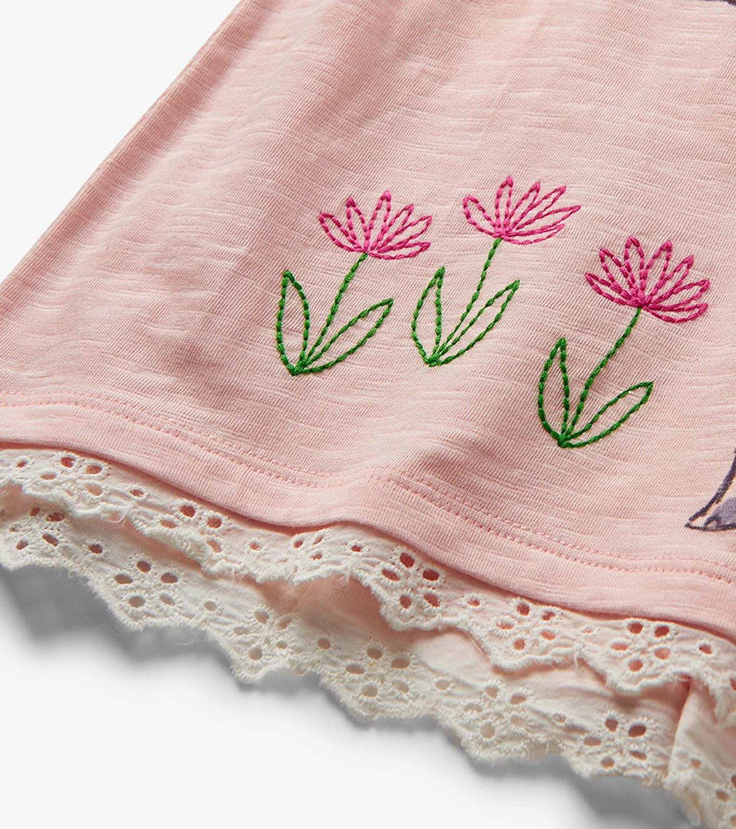Pink toddler T-shirt with embroidered flowers and lace hem detail