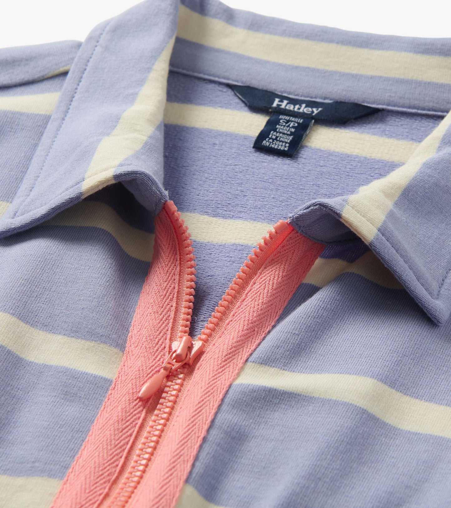 Close-up of a pale iris striped maxi dress with pink zipper placket and collar detail