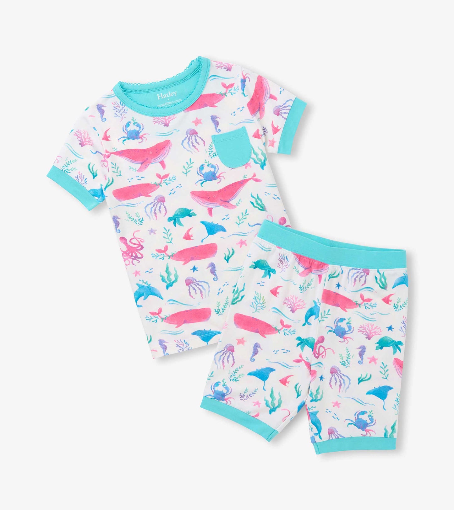 White short pajama set with pastel whales, crabs, turtles and seaweed print, aqua trim and chest pocket
