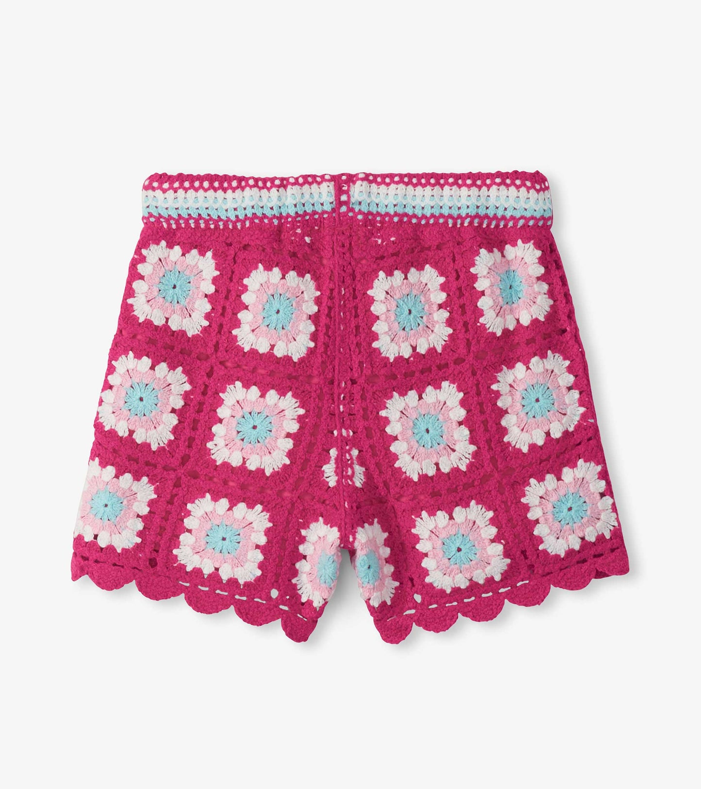 Pink crochet girls shorts with scalloped hem and pastel floral pattern, front view