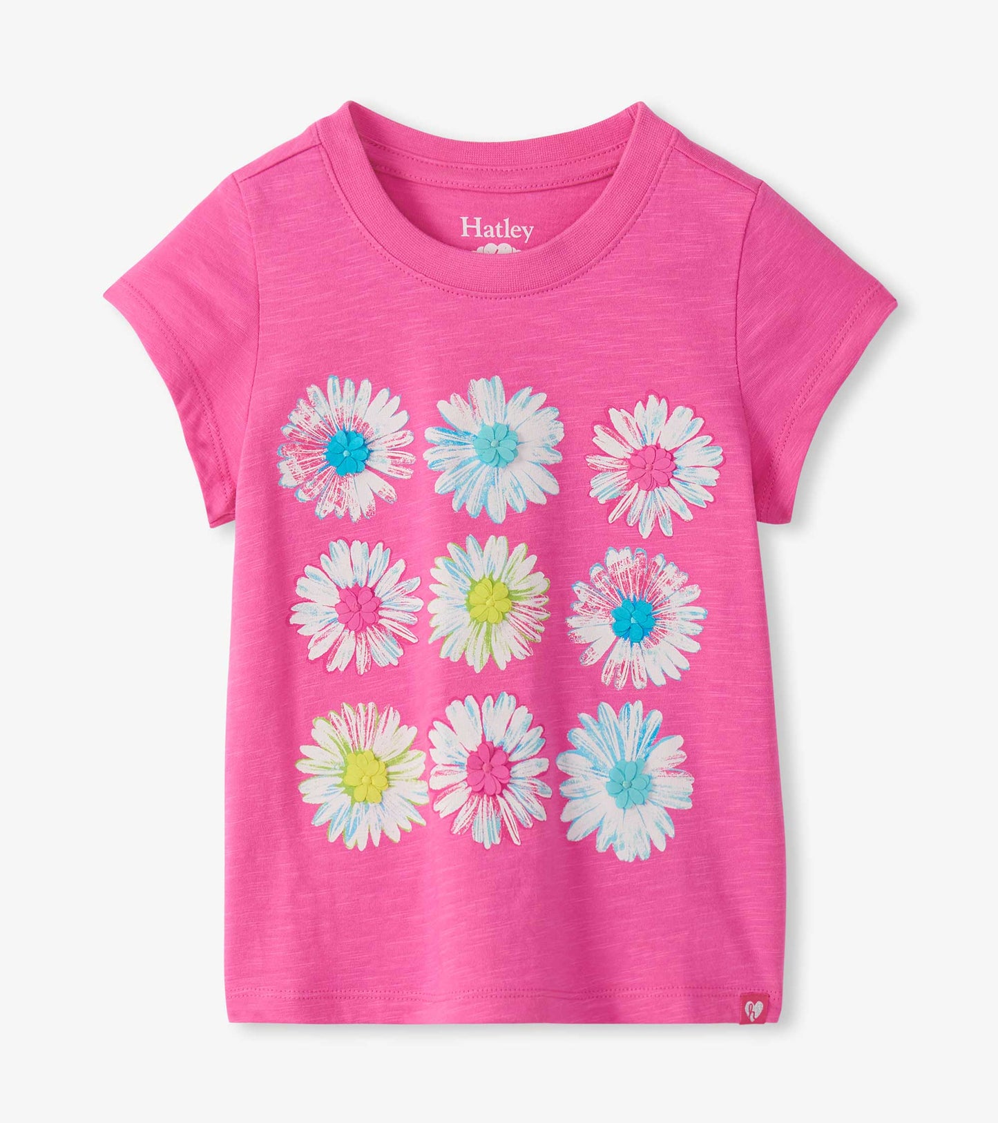 Bright pink short sleeve tee with nine white daisy graphics and colorful raised flower centers