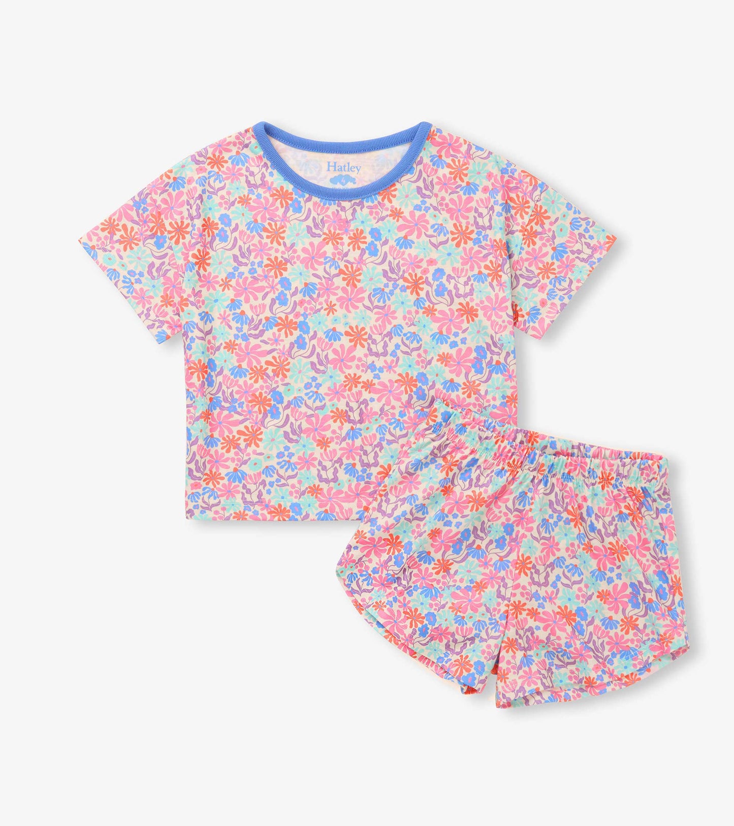 Girls floral sleep set with short-sleeve top, blue trim neckline, and matching pull-on shorts