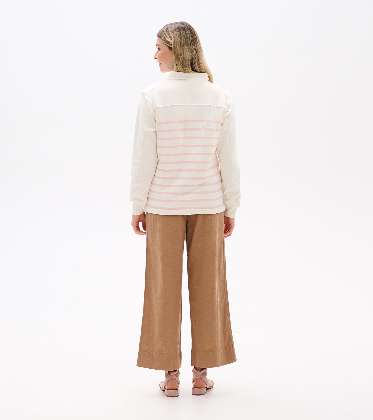 Back view of cream long-sleeve top with pink horizontal stripes and collared neckline
