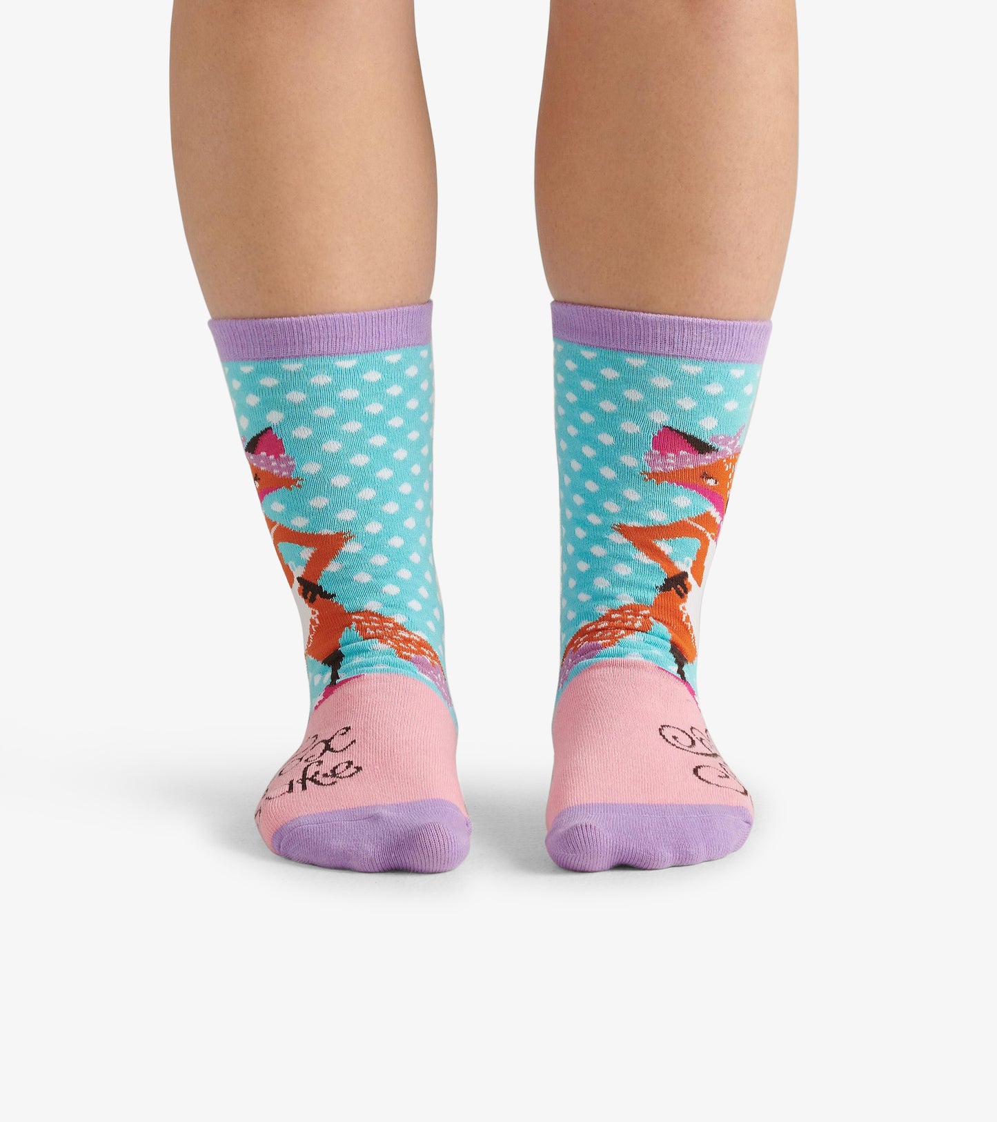 Light blue crew socks with polka dots, featuring a fox design and pink accents at the toe and cuff.