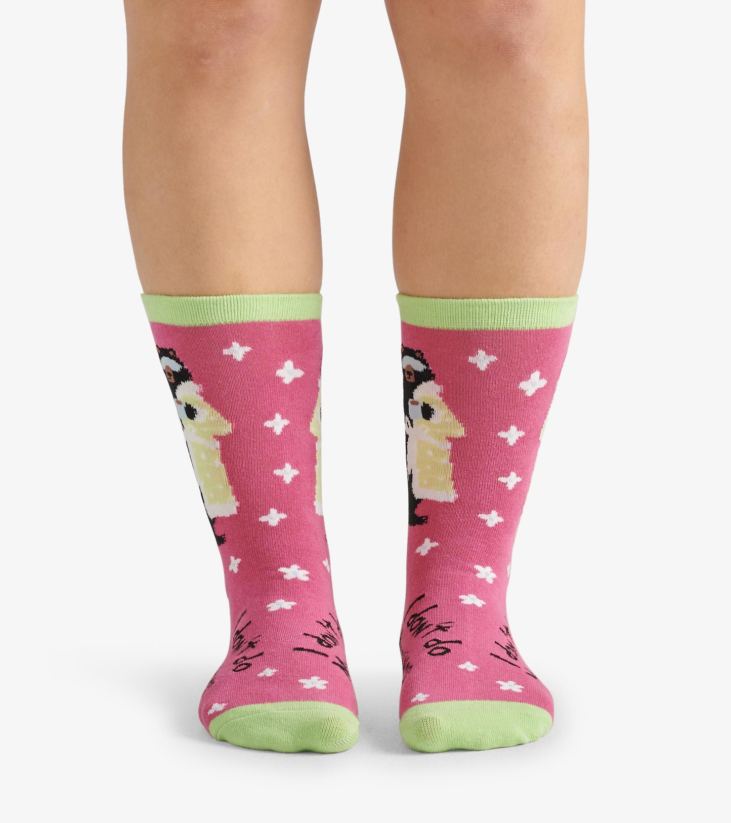 Pink crew socks featuring a whimsical design with a character in a yellow robe and green cuffs, suitable for casual wear.