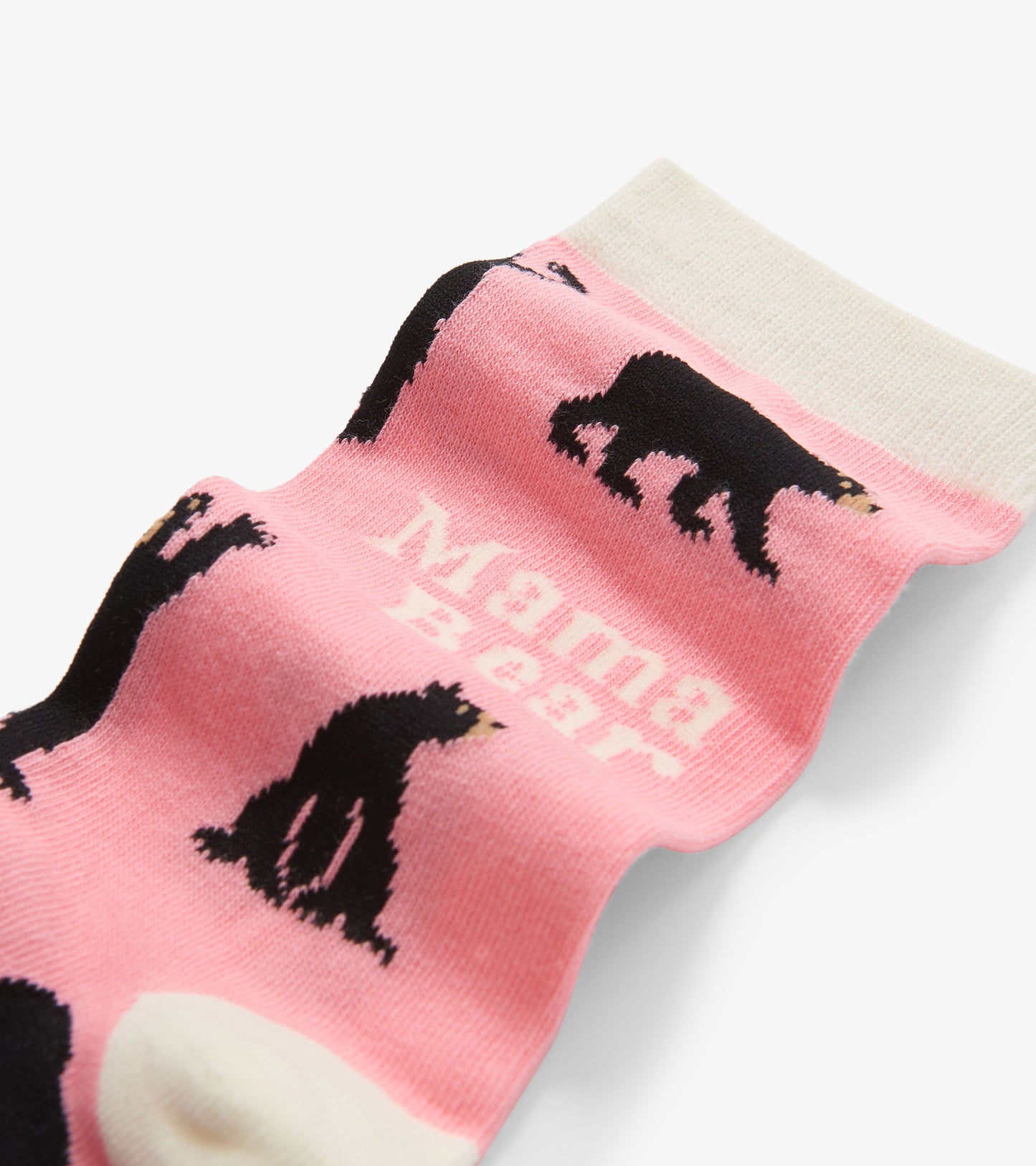 Pink crew socks featuring black bear graphics and "Mama Bear" text, with a contrasting white cuff.