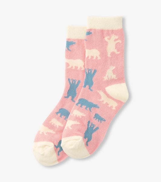 Pink crew socks featuring polar bear patterns in blue and cream, ideal for kids.