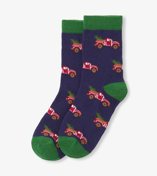 Red truck pattern on navy socks with green cuffs and toes, designed for boys ages 2-7.