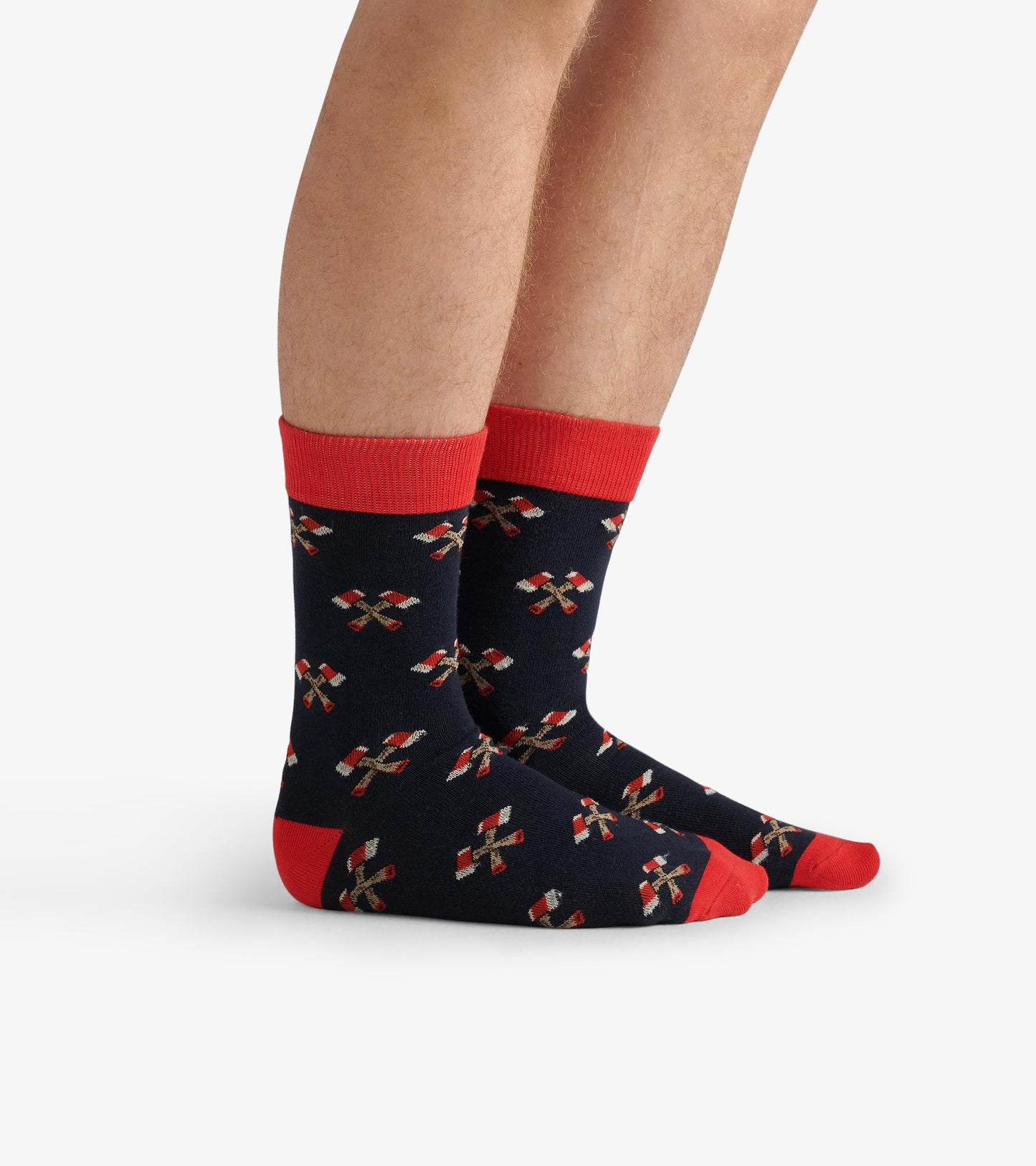 Navy crew socks with red accents and a festive pattern of candy canes, suitable for casual wear.