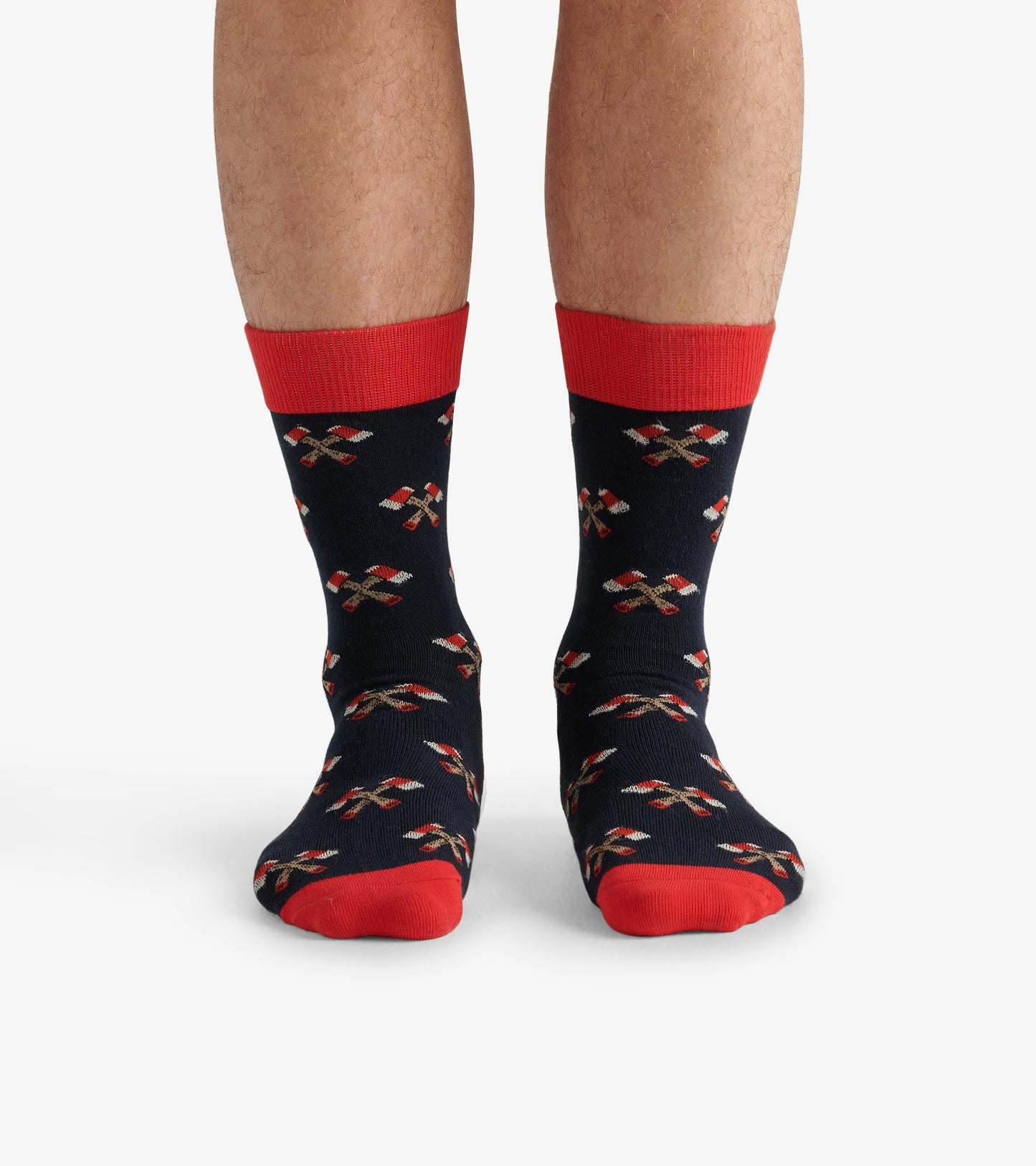 Navy crew socks with red cuffs and toe, featuring a festive pattern of candy canes and holly leaves.