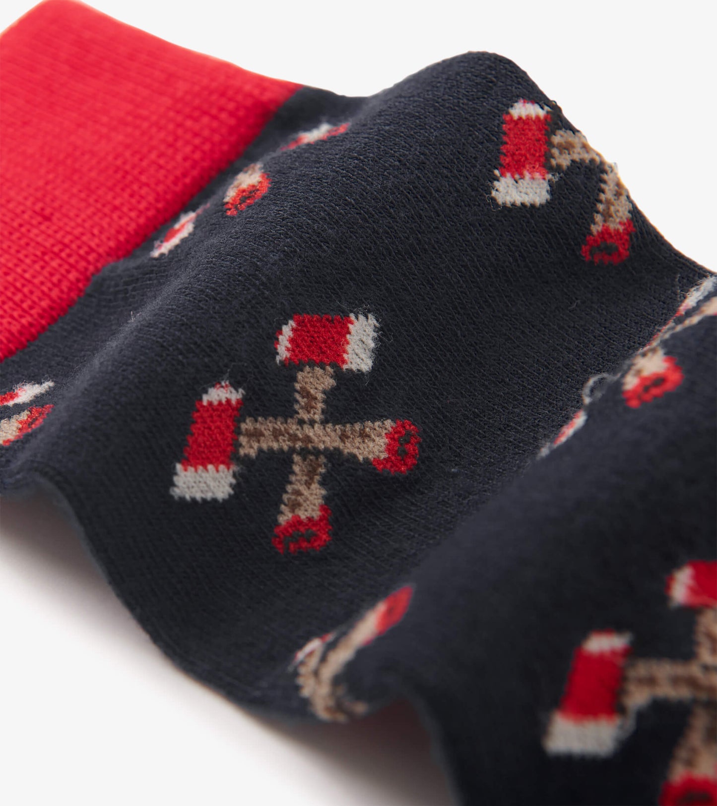 Navy crew socks featuring a playful pattern of red and beige axes, with a contrasting red cuff.