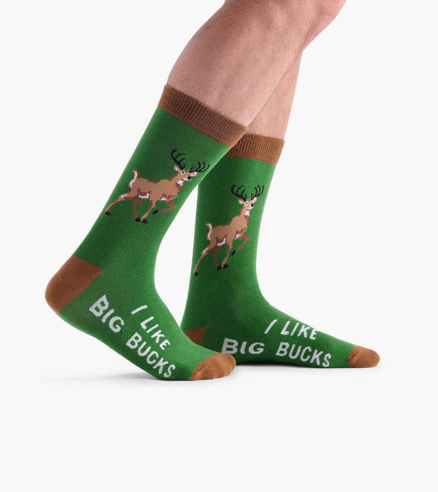 Green crew socks featuring a deer graphic and the text "I Like Big Bucks," with brown accents on the cuffs and toes.