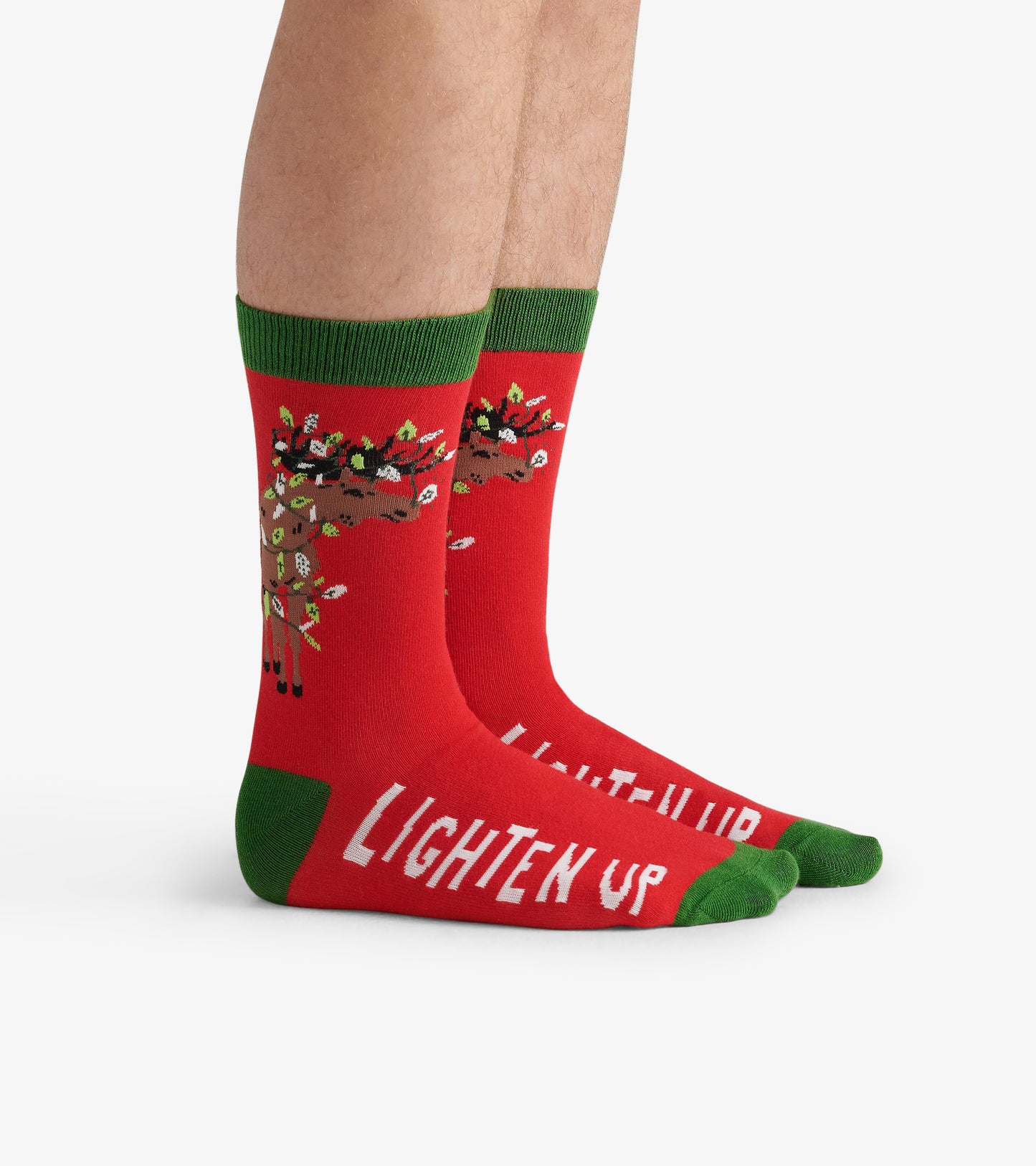 Red crew socks featuring a moose design with green accents and "LIGHTEN UP" text on the foot. One size fits all.