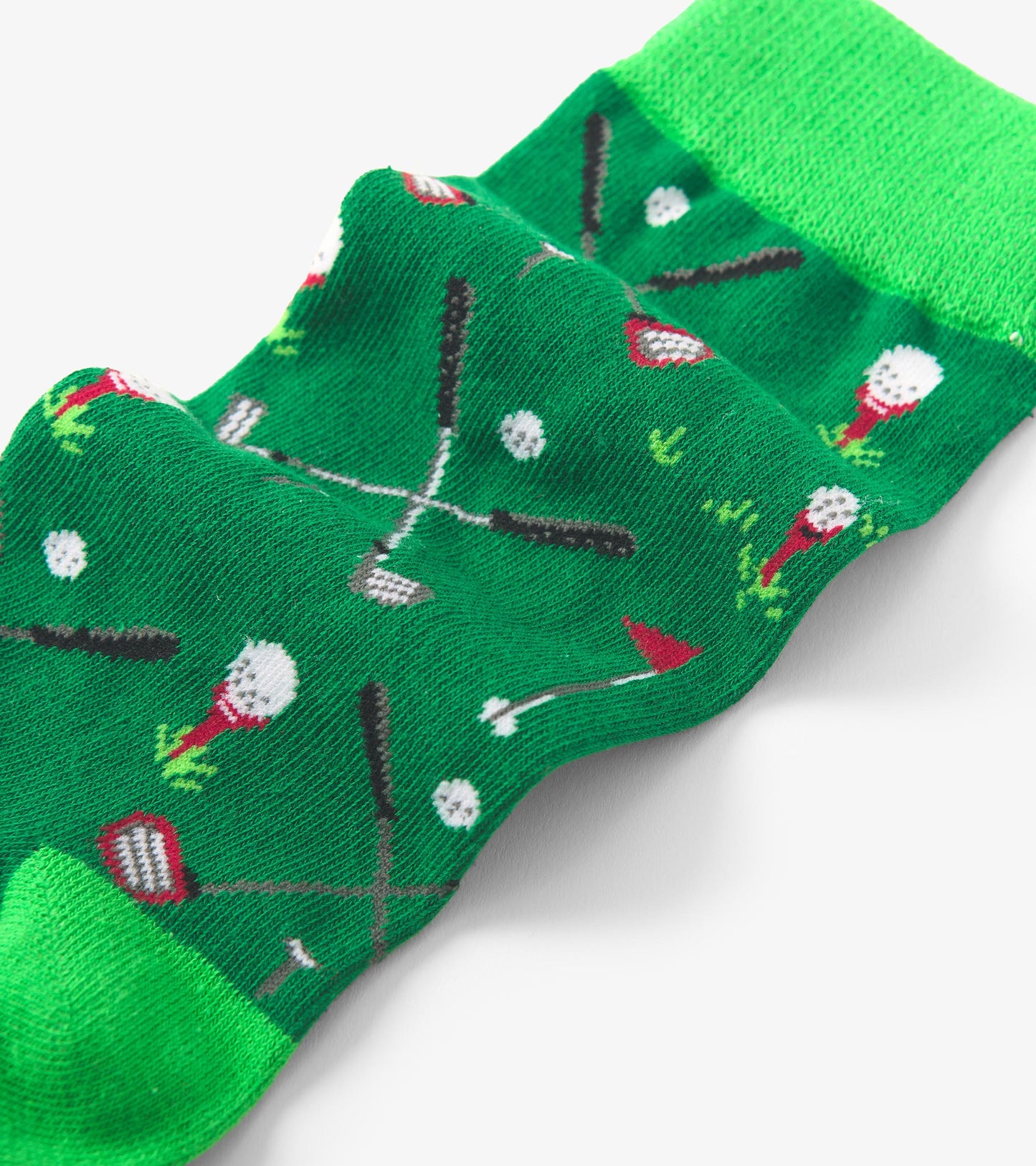 Green crew socks featuring a playful golf-themed pattern with clubs and golf balls. One size fits all.