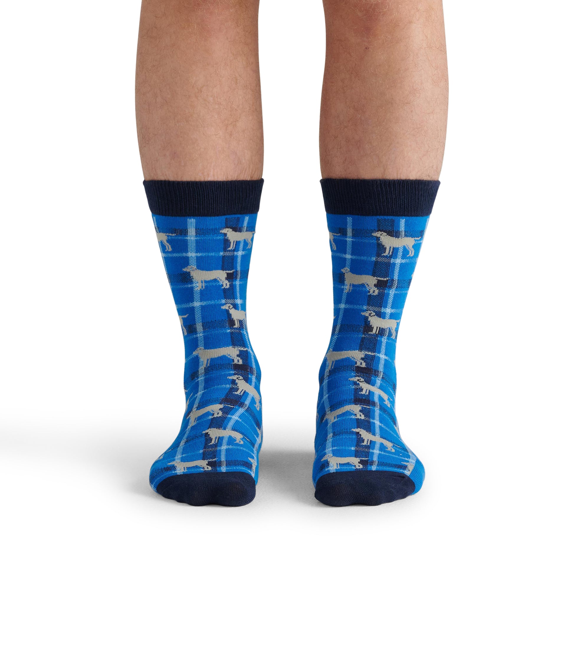 Blue crew socks featuring a plaid pattern with playful dog illustrations and a navy cuff. One size fits most.
