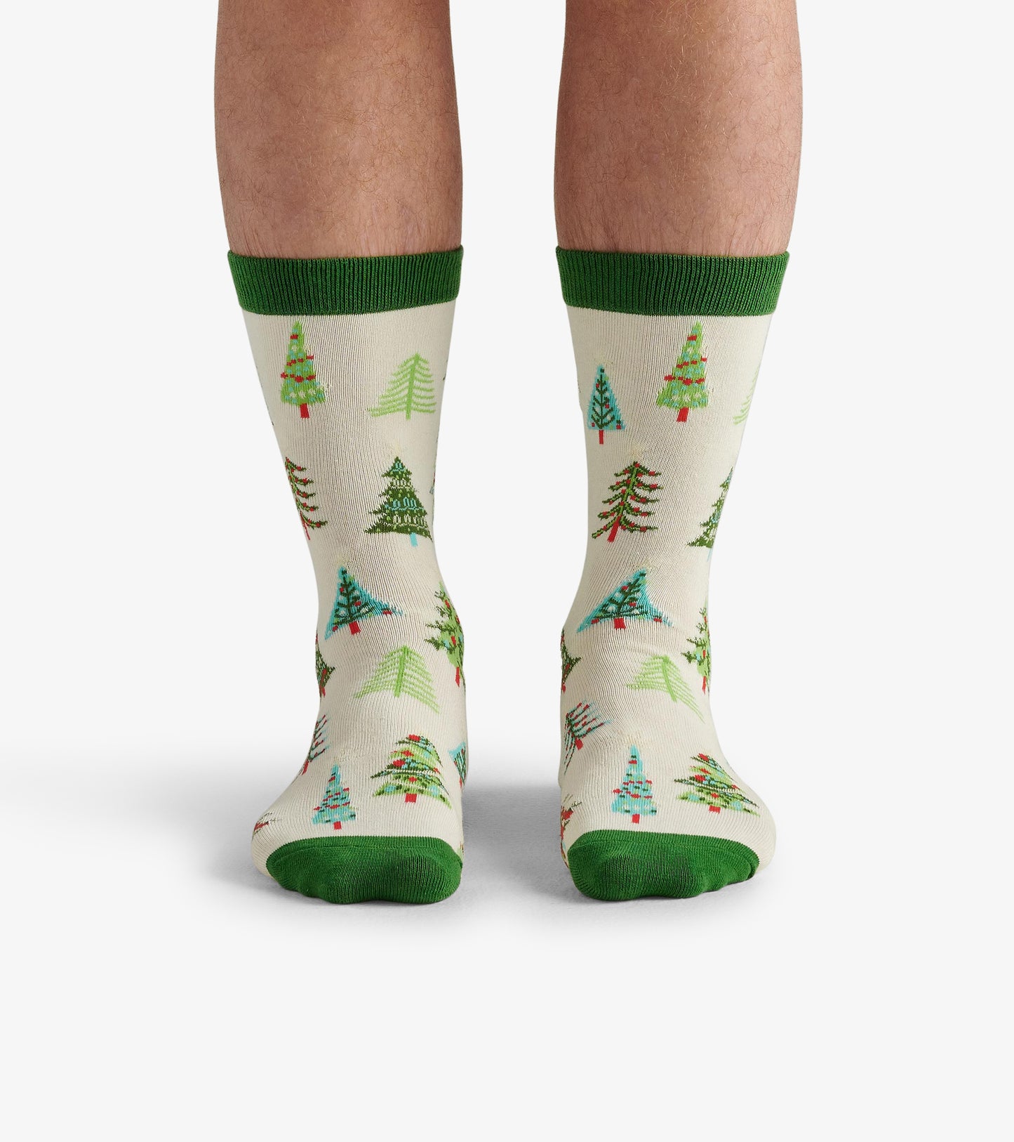 Beige crew socks featuring colorful Christmas tree patterns and green accents at the cuff and toe. One size fits all.