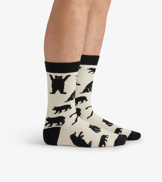 Beige crew socks featuring black bear patterns, with a black cuff and toe. One size fits most.