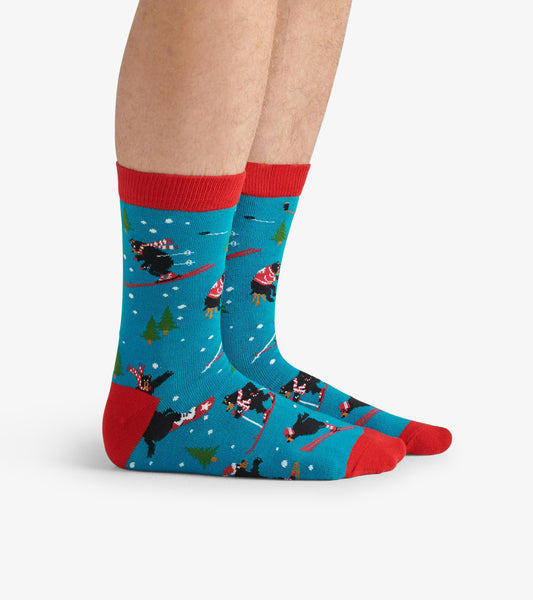 Turquoise crew socks featuring skiing bears, red accents, and a winter theme, suitable for casual wear.